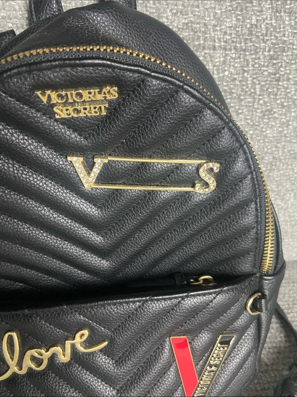 Victoria's Secret Black Quilted Mini Backpack with Gold Accents and Red Detail